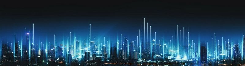 A futuristic cityscape at night, with dozens of skyscrapers lit up in blue light.