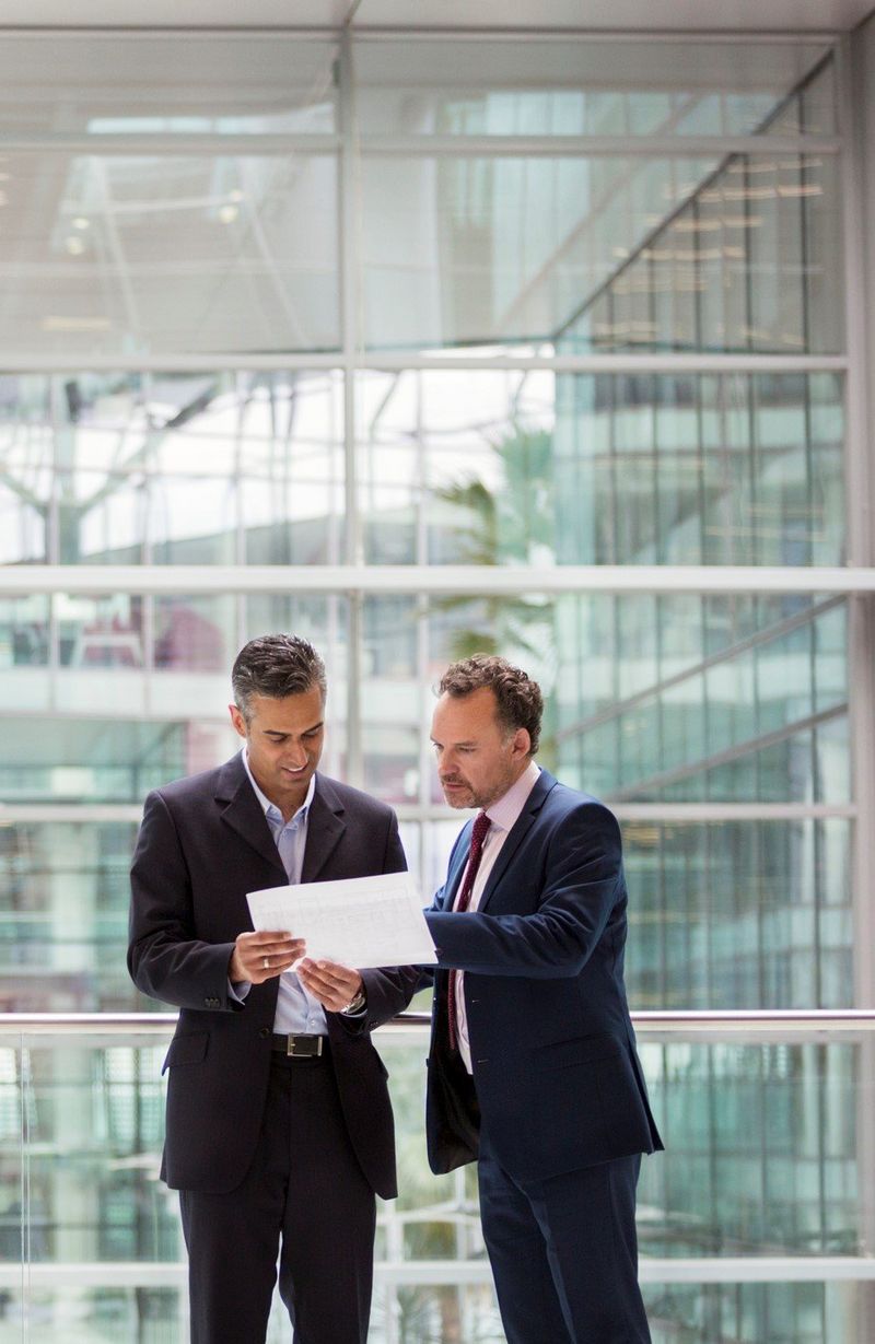 Businessmen discussing portrait