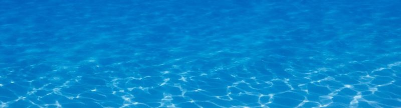 A dark blue background, covered with dozens of bubble-like circles in different shades of blue – like the bubbles you might see underwater.