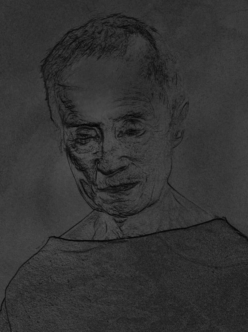 A same portrait, but this is a photograph of its print in black, with the details of the photograph printed in relief in order to be touchable.