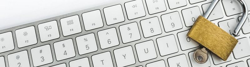 A lock and key, sat on a keyboard