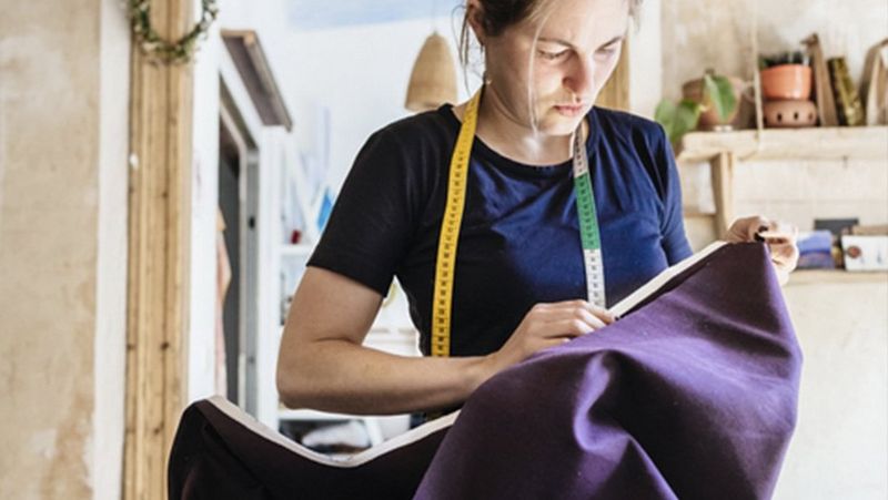 Female-clothing-designer-with-fabric_business