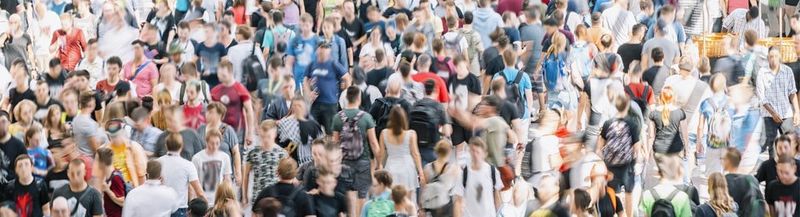 A crowd of people, photographed in black and white