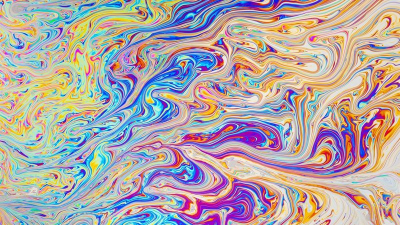 A garland of photos printed on the Canon SELPHY SQUARE QX10 hanging from the wall.