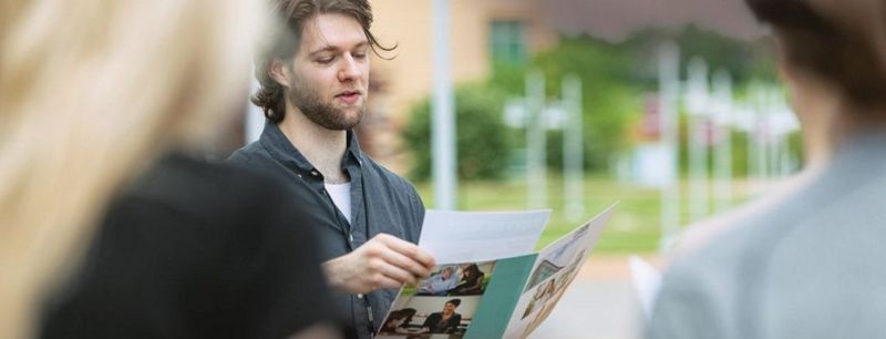 Man looking at a printed document