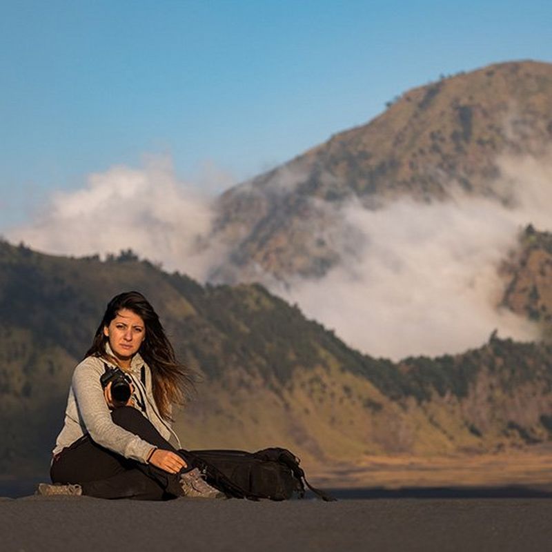 Magali Tarouca sat in front of a volcano
