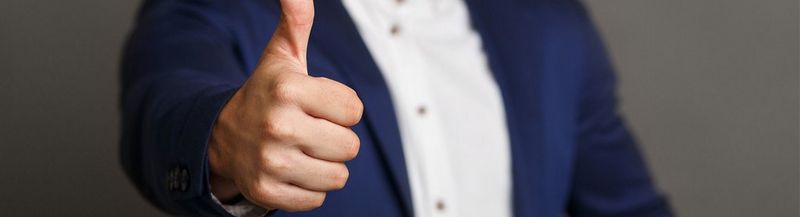 Woman’s hands, holding a mug with ‘like a boss’ written on it in handwriting script