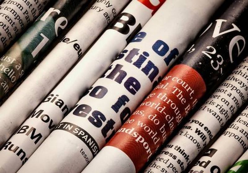 Folded newspapers in a row