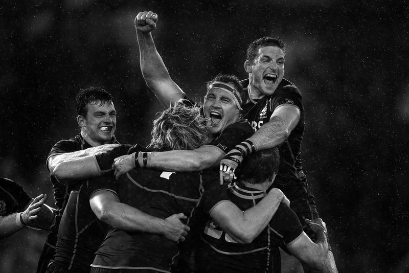 Scotland rugby players celebrating. Photo by Mark Kolbe with a Canon EF 400mm f/2.8L IS II USM lens.