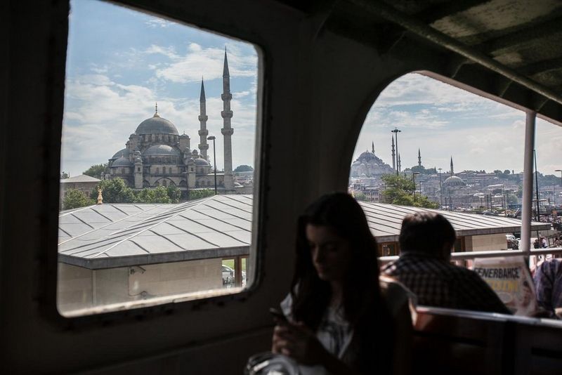 Woman on a train on her mobile