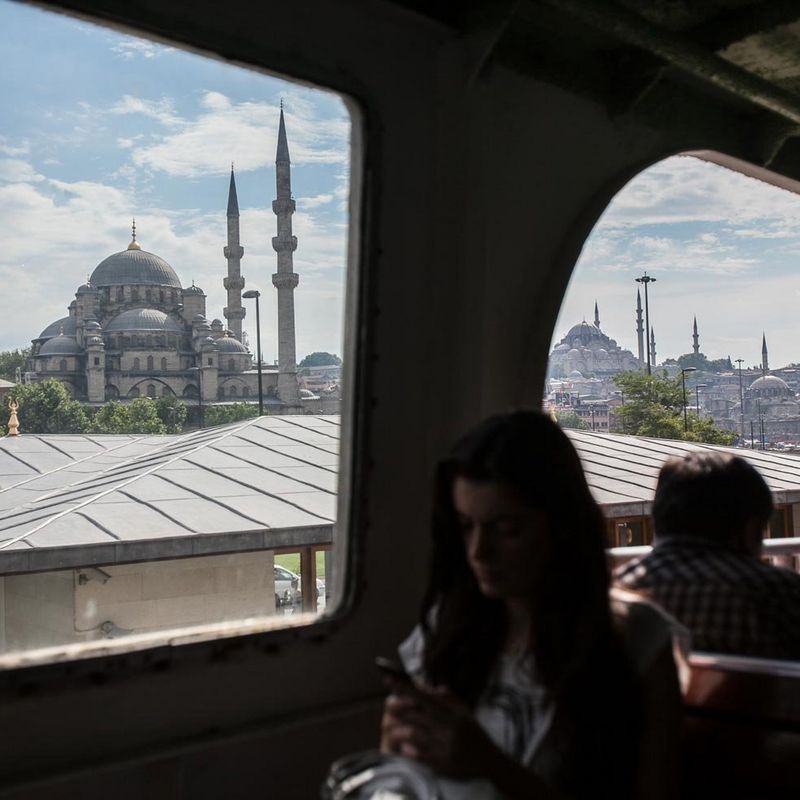 Woman on a train on her mobile