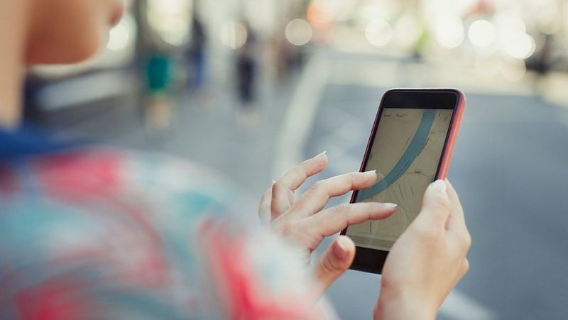 Person looking at map on mobile phone