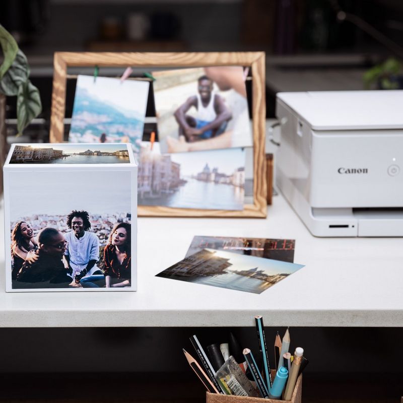 Canon Photo Cube and Frame + PP-201 5x5” Photo Paper Plus Glossy II (40 sheets) - Creative Pack, Orange Photo cube kept next to a canon printer