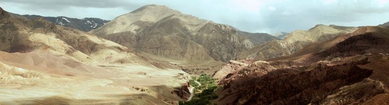 A mountain landscape, with a verdant Kabul to Bamyan road running through it.