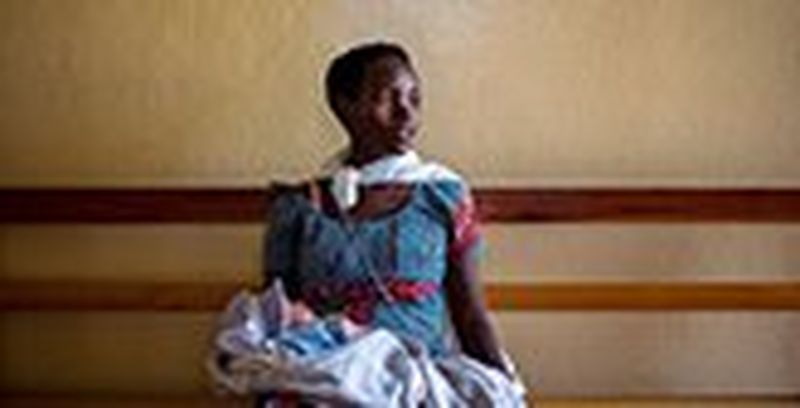 Woman holding her child