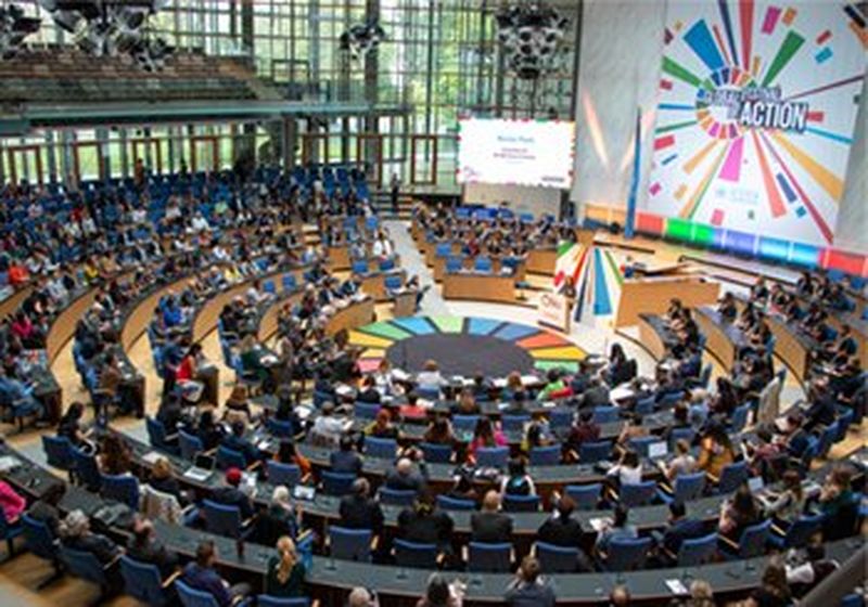 Attendees of the United Nations Global Festival of Action listen to event speakers