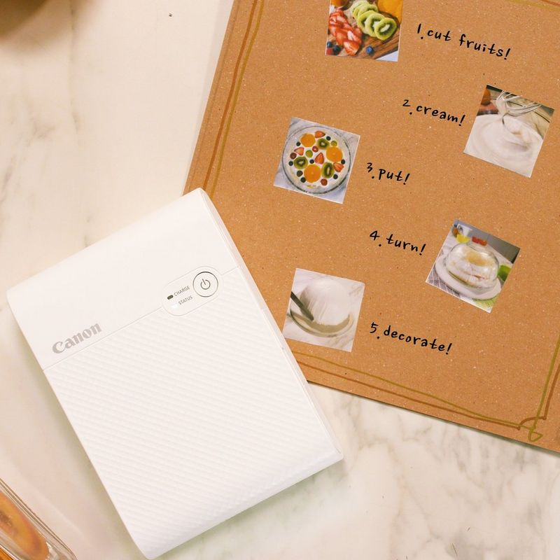 Canon SELPHY SQUARE QX10 mobiler WLAN-Farbfotodrucker, Weiß Vorderansicht mit Fotomenü