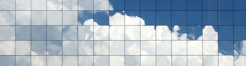 Clouds reflected in glass windows.
