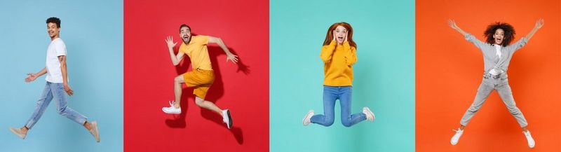 Four people photographed separately on coloured backgrounds. Left to right: A man in a white t-shirt and blue jeans, turned to one side and jumping in mid-air with legs apart against a blue background. A man in orange shorts, a yellow t-shirt and white sneakers, posing as though running while pulling a silly face, against a red background. A woman in a yellow jumper, blue jeans and white sneakers jumping with her hands against her face on a turquoise background and a woman in a grey shirt, grey jeans and white sneakers, star-jumping against an orange background.