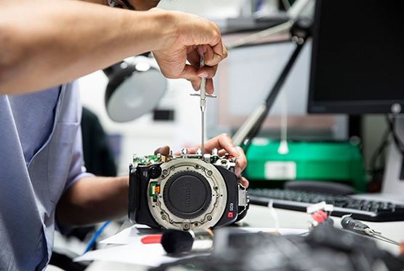 A specialist working on a Canon EOS C body