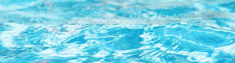 Very blue water, with light reflecting on it.