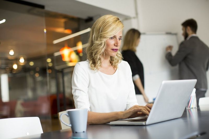 Office professional doing research on adaptability and risk mitigation