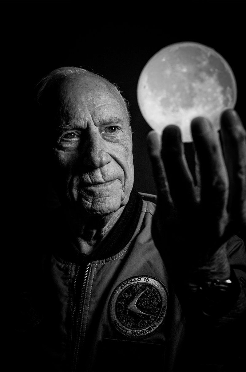 Al Worden holding hand up as if he is holding the moon