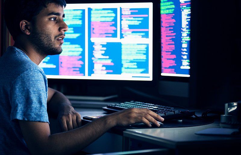 Man working on computer with data