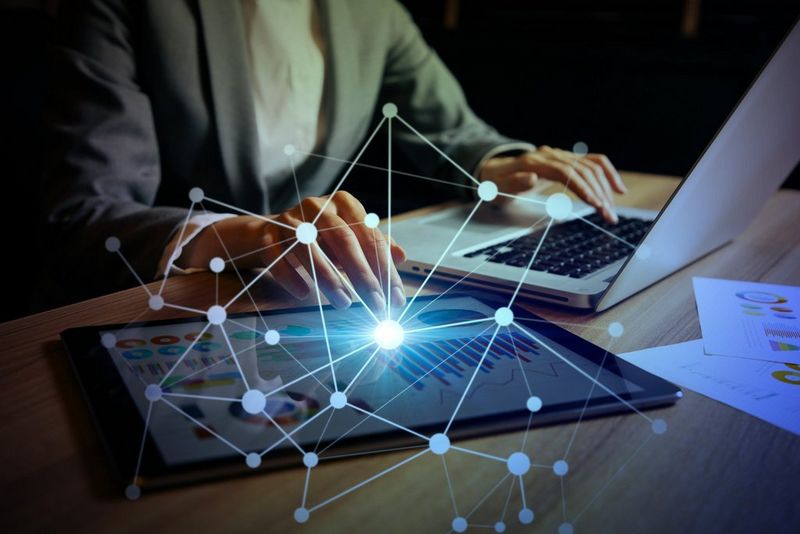 businesswoman_using_digital_devices_internet_of_things_metamorworks_gettyimag