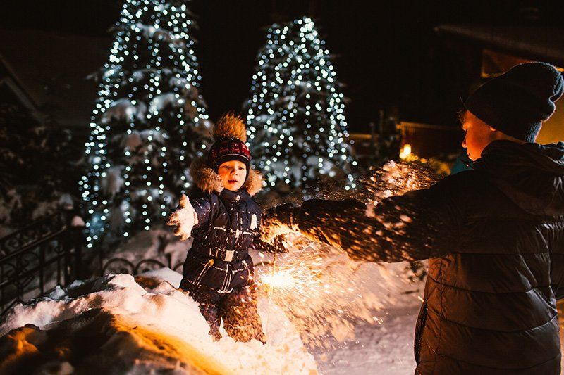 Two boys play in snow.