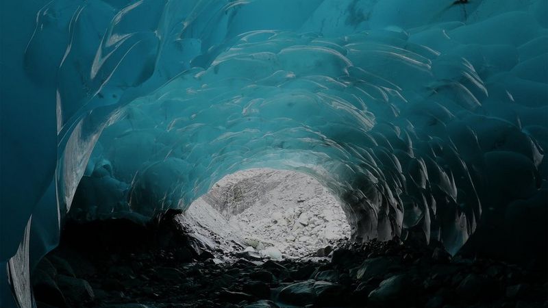 Inside a blue-green ice cave.