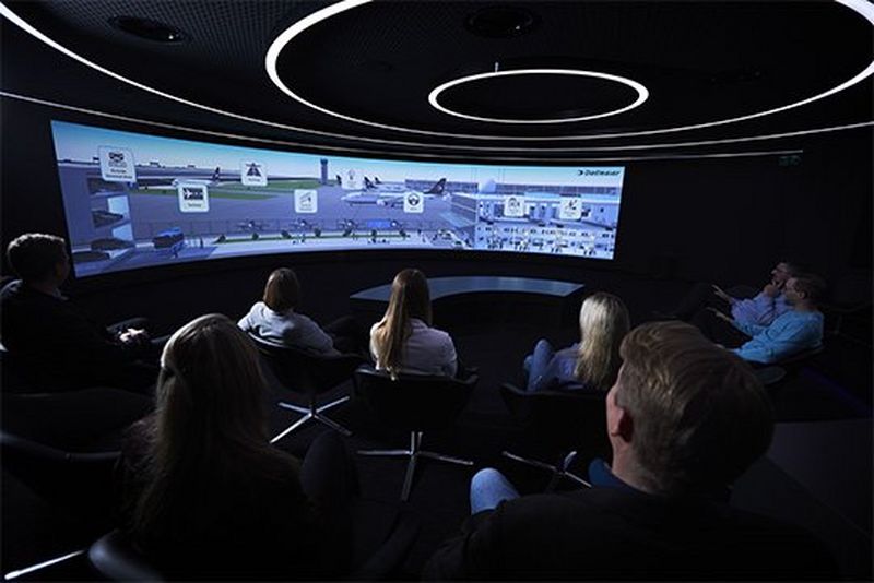 A panoramic shot of a video being projected onto the presentation wall.