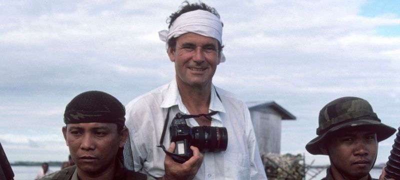 Magnum photographer Bruno Barbey with a Canon camera on an assignment.