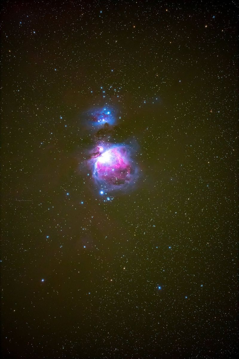 A night sky image with purple nebula.