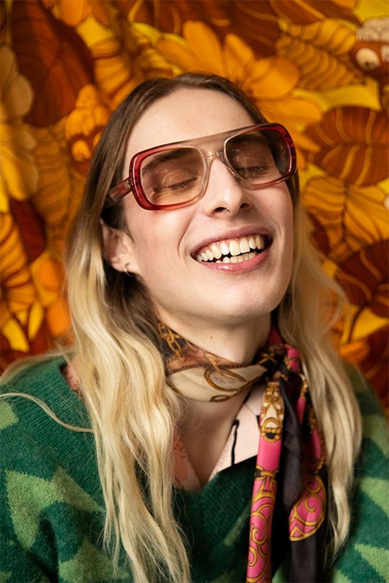 A long-haired model smiles. Photo by Wanda Martin on a Canon EOS-1D X Mark II.