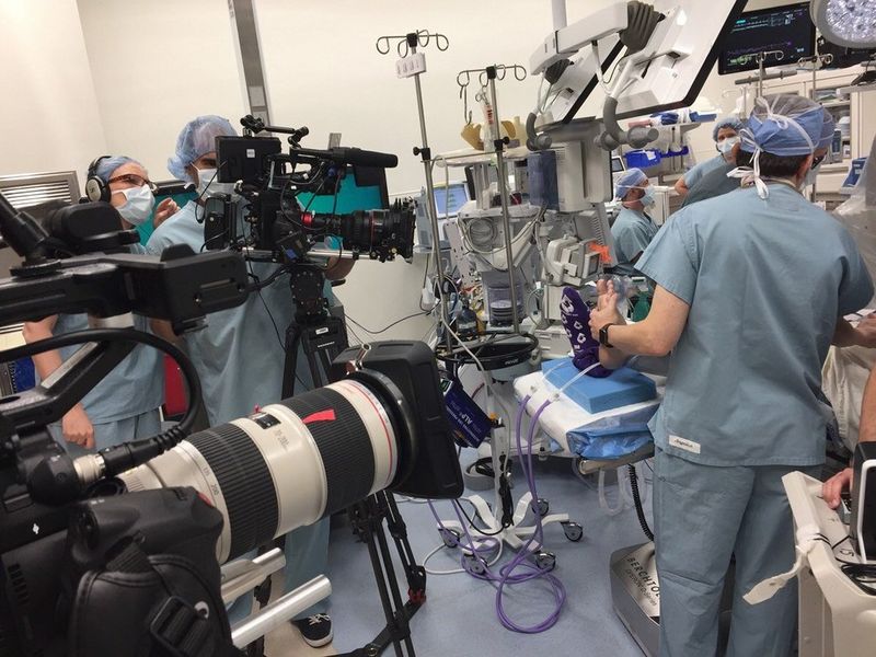 The crew of Hunting for Hedonia film in an operating theatre with Canon cameras and lenses.