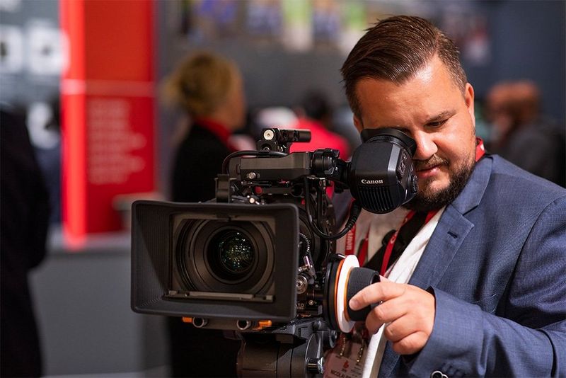 Nicolai Brix points a Canon video camera at us.