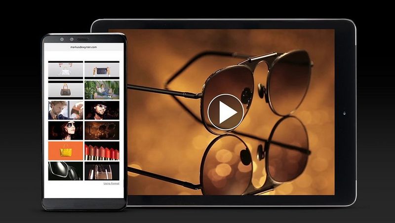 Social media video thumbnails on Quentin Caffier&#39;s website on a smartphone, with one of his social videos playing on a tablet behind.