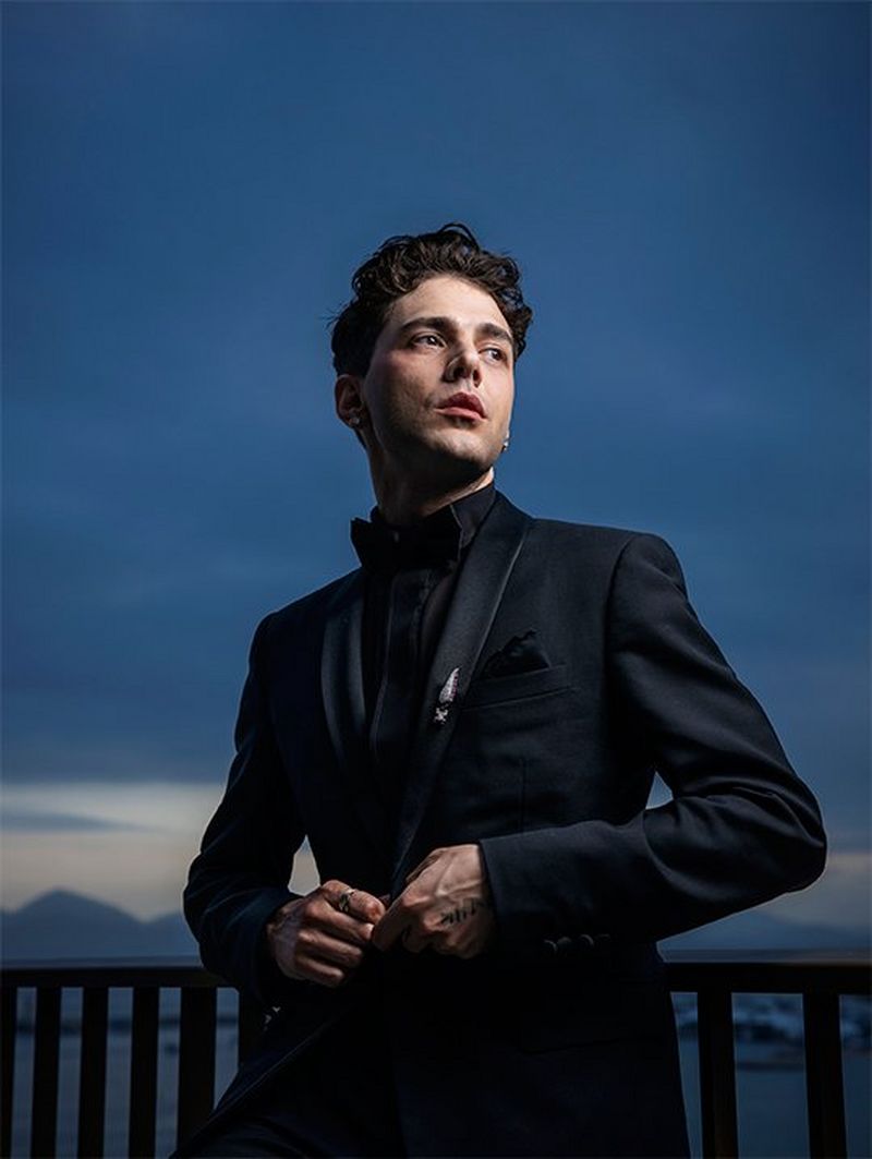 Director and actor Xavier Dolan on a balcony overlooking the Bay of Cannes in the evening light. Photograph by Paolo Verzone on a Canon EOS R.
