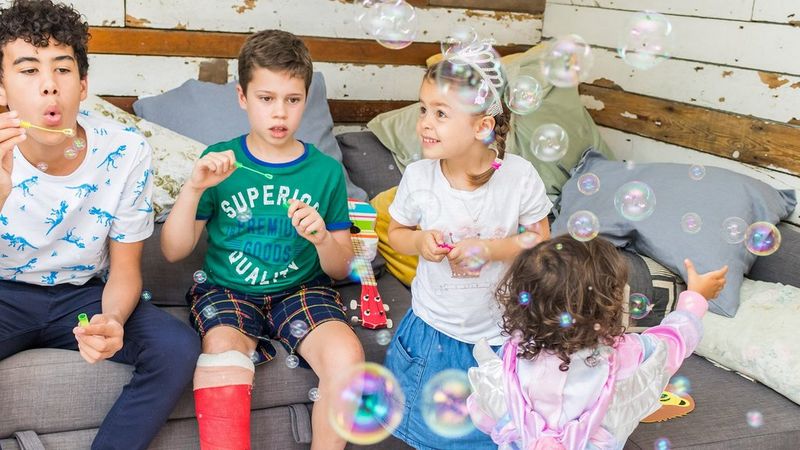 Children at a party blowing bubbles shot using the Canon Speedlite EL-100