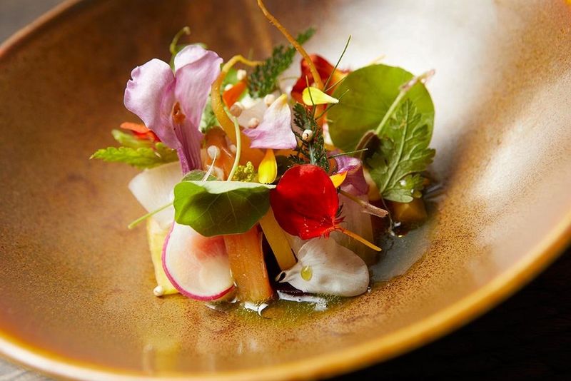 A herb and flower-filled plate from chef Peter Gast’s restaurant 't Schulten Hues in Zutphen, Holland, shot on a Canon EOS 5D Mark IV with a Canon EF 24-70mm f/2.8L USM at 54mm.