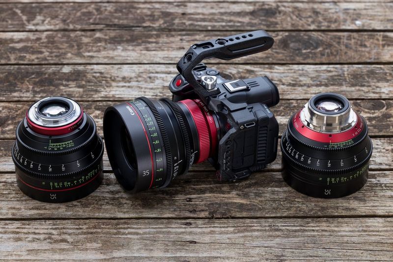 A Canon CN-R Prime lens mounted on an EOS R5 C alongside a CN-Prime lens and a Sumire Prime lens.