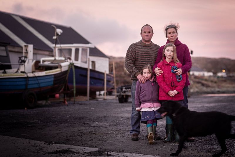 Boat builder Angus Newman, vet Beth Newman and their daughters in a boatyard at sunset captured by Clive Booth on the Canon EOS-1D X.