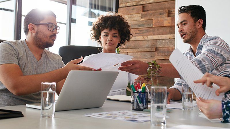colleagues discussing streamlined printing for faster, smarter working