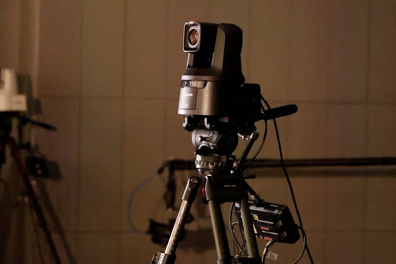 A Canon CR-N500 camera on a tripod.