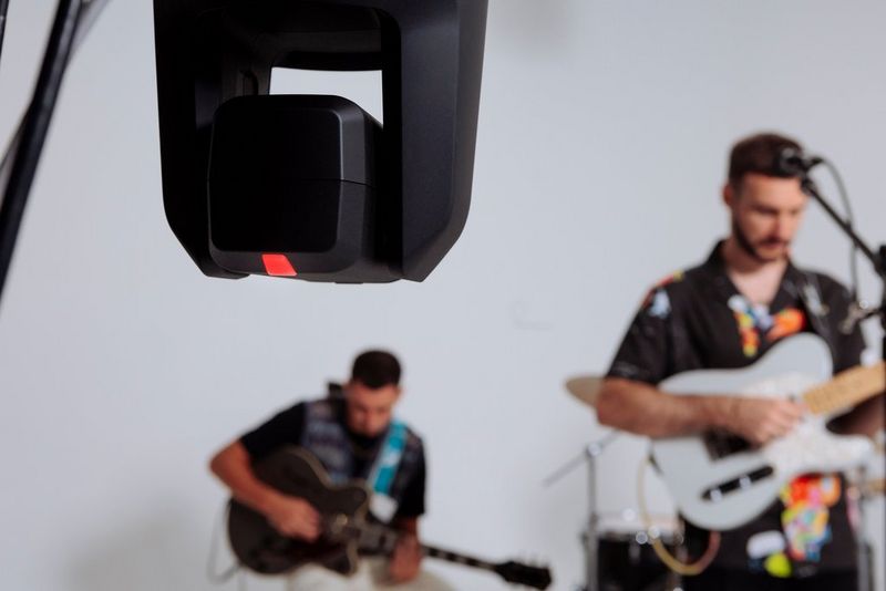 A Canon CR-N700 camera recording a band from an elevated position.