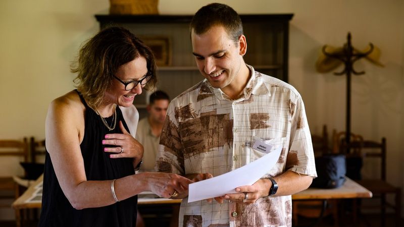 Fiona Shields reviews an image with a student at the 2024 Canon Student Development Programme.
