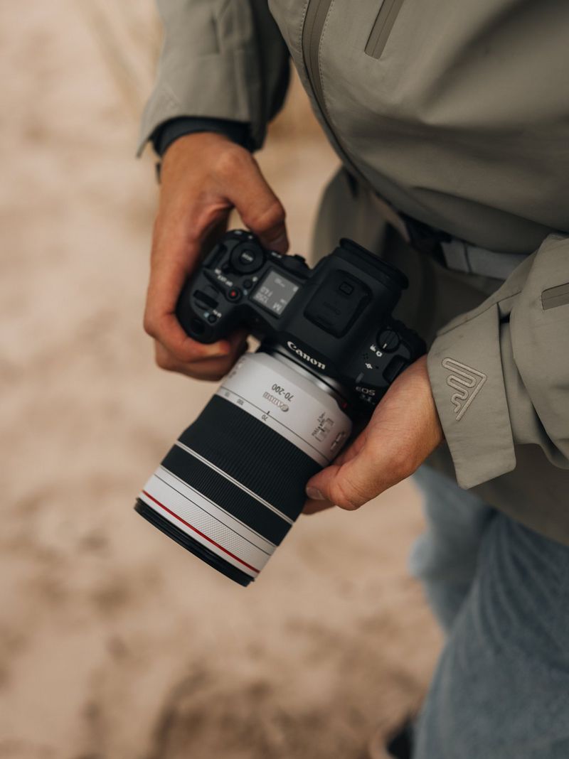 Travel photographer Cuno de Bruin holds a Canon EOS R5 Mark II with a Canon RF 70-200mm F2.8L IS USM lens.