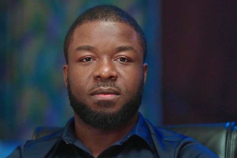 A portrait photograph of director Daniel Ehimen.