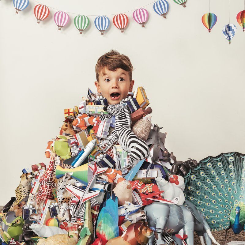 Child buried in a mountain of gifts